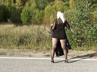 mature Walking on the road in a mini dress babe blonde